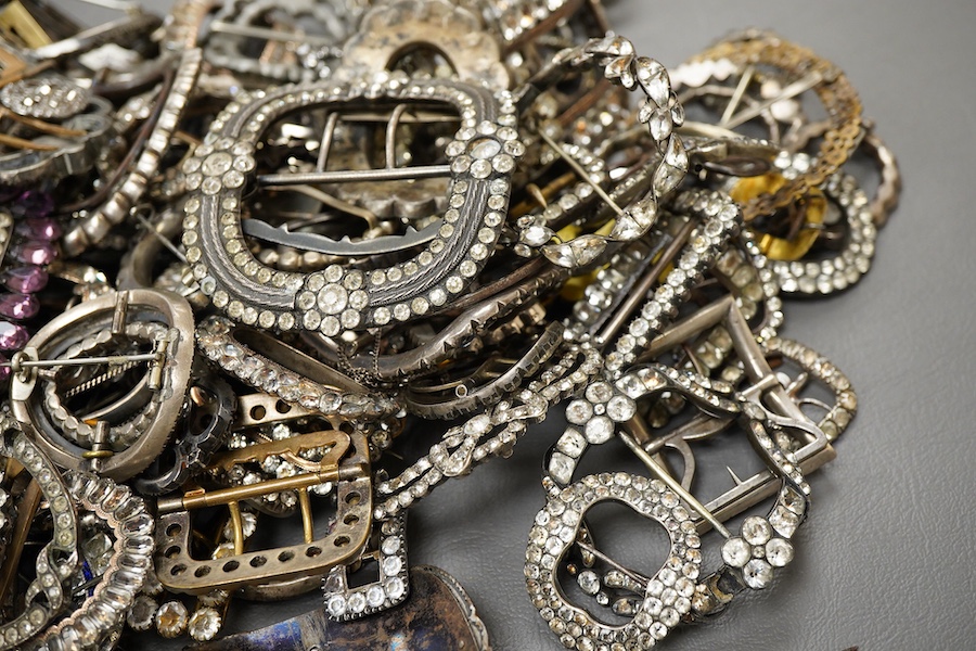 A large collection of buckles, 18th-early 20th century, of oval and rectangular outline, set with pastes, some with cut steel, mostly mounted in steel, a minority in silver, some with later brooch fittings